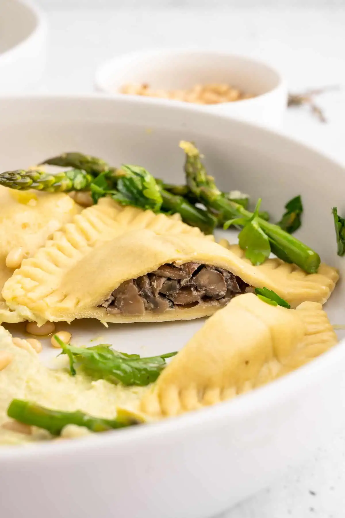 A vegan ravioli, cut open to show its interior.