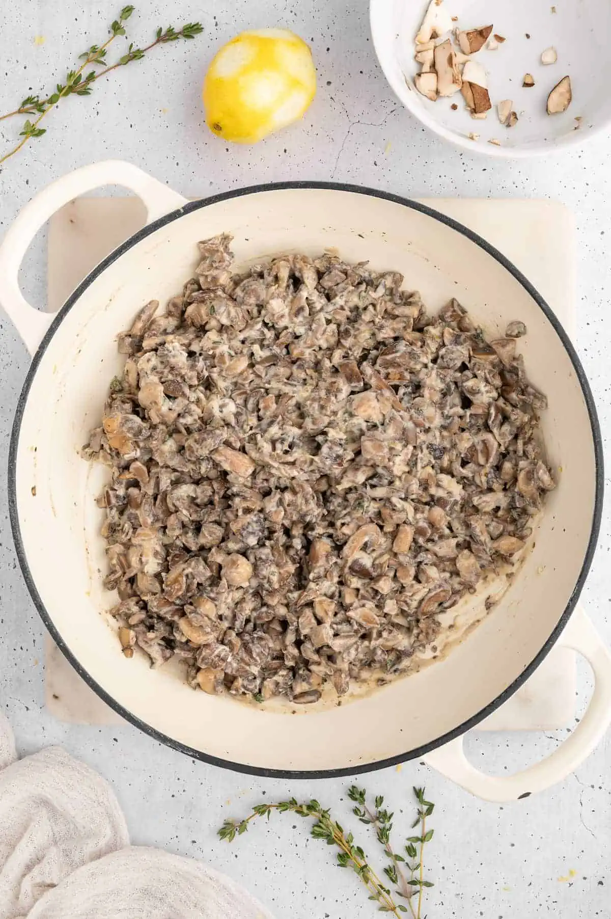 A mushroom filling prepped in a sauté pan.