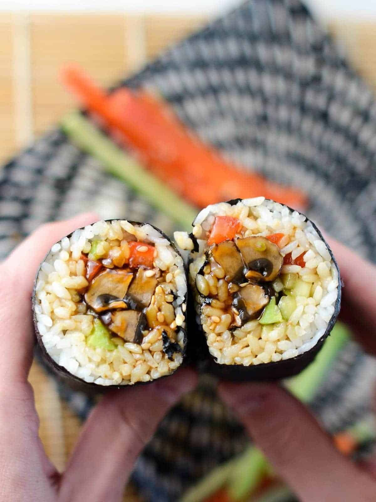 A vegan sushi burrito with mushrooms.