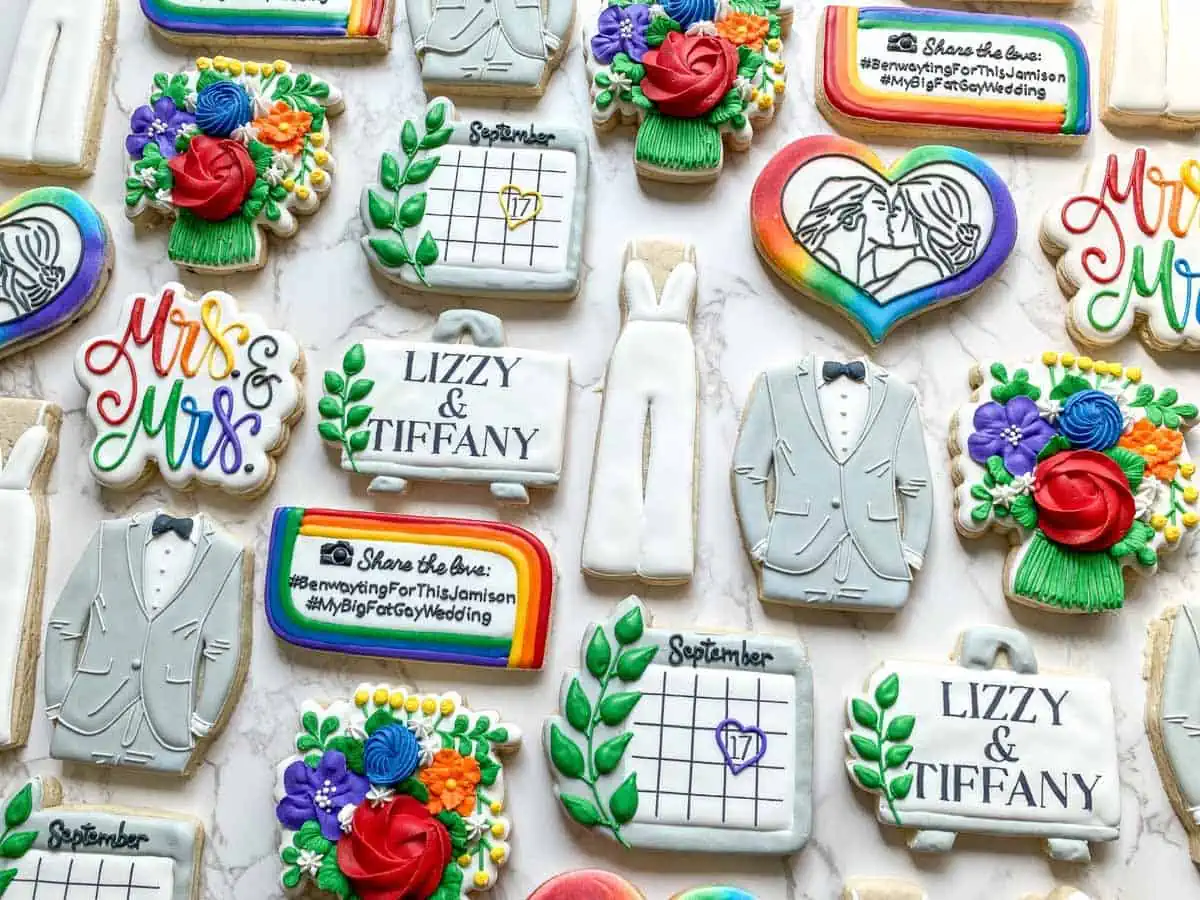 Beautiful vegan frosted rainbow wedding cookies celebrating. 