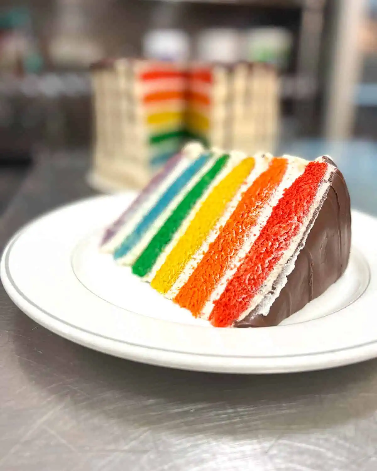 Vegan rainbow cake for wedding rehearsal dinner at Cleveland Vegan restaurant and catering company. 