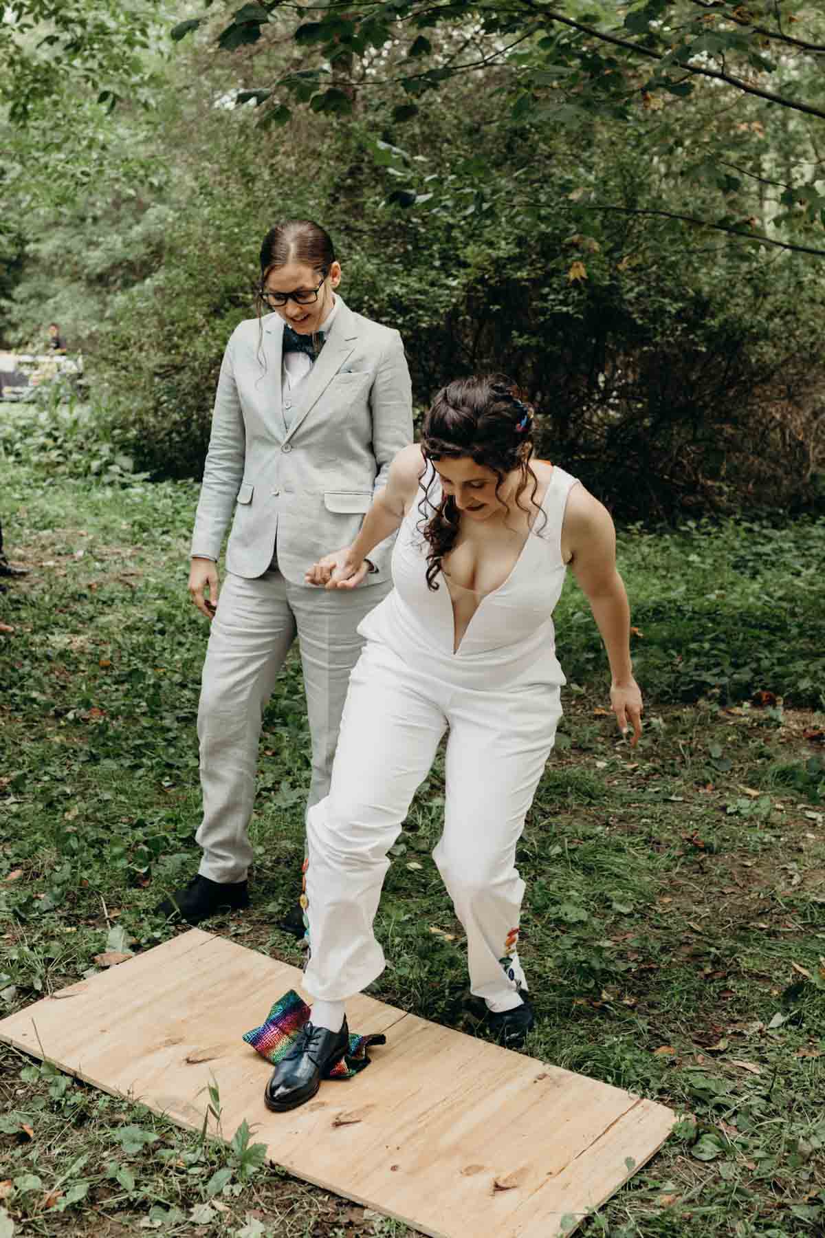 Jewish wedding tradition of breaking the glass by bride in the woods.  