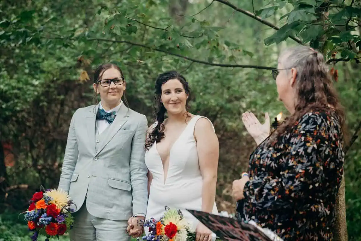 Beautiful queer vegan brides ordained by their mom. 