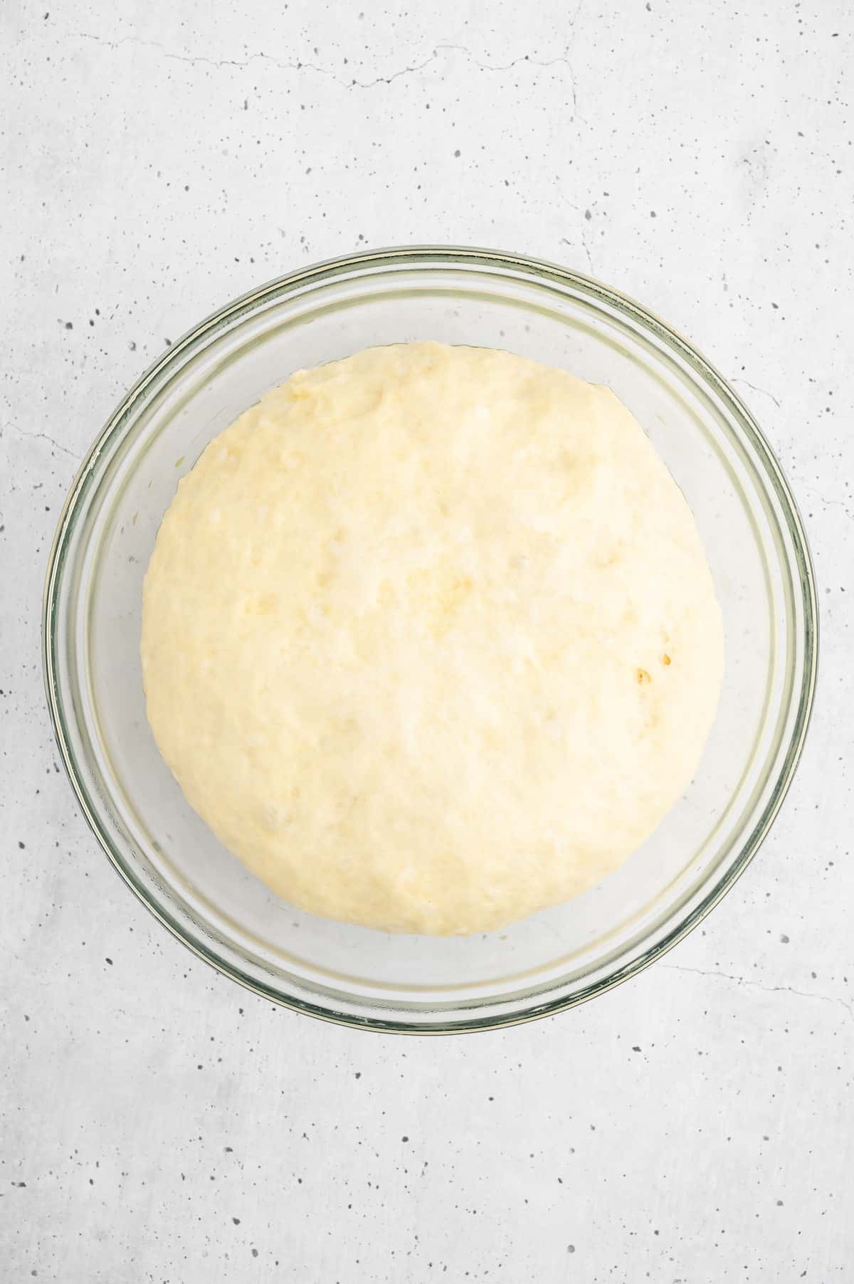 A ball of vegan bread dough, doubled in size.