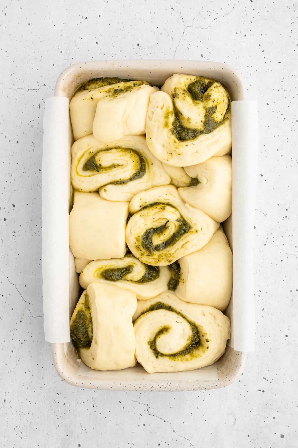 Pest bread pieces assembled in a baking dish.