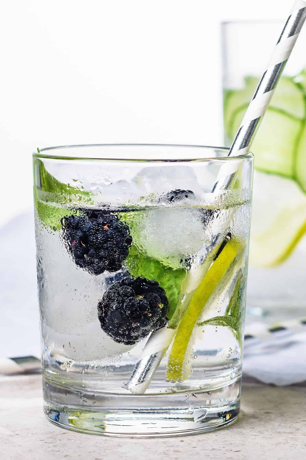 A glass of basil raspberry-infused water.