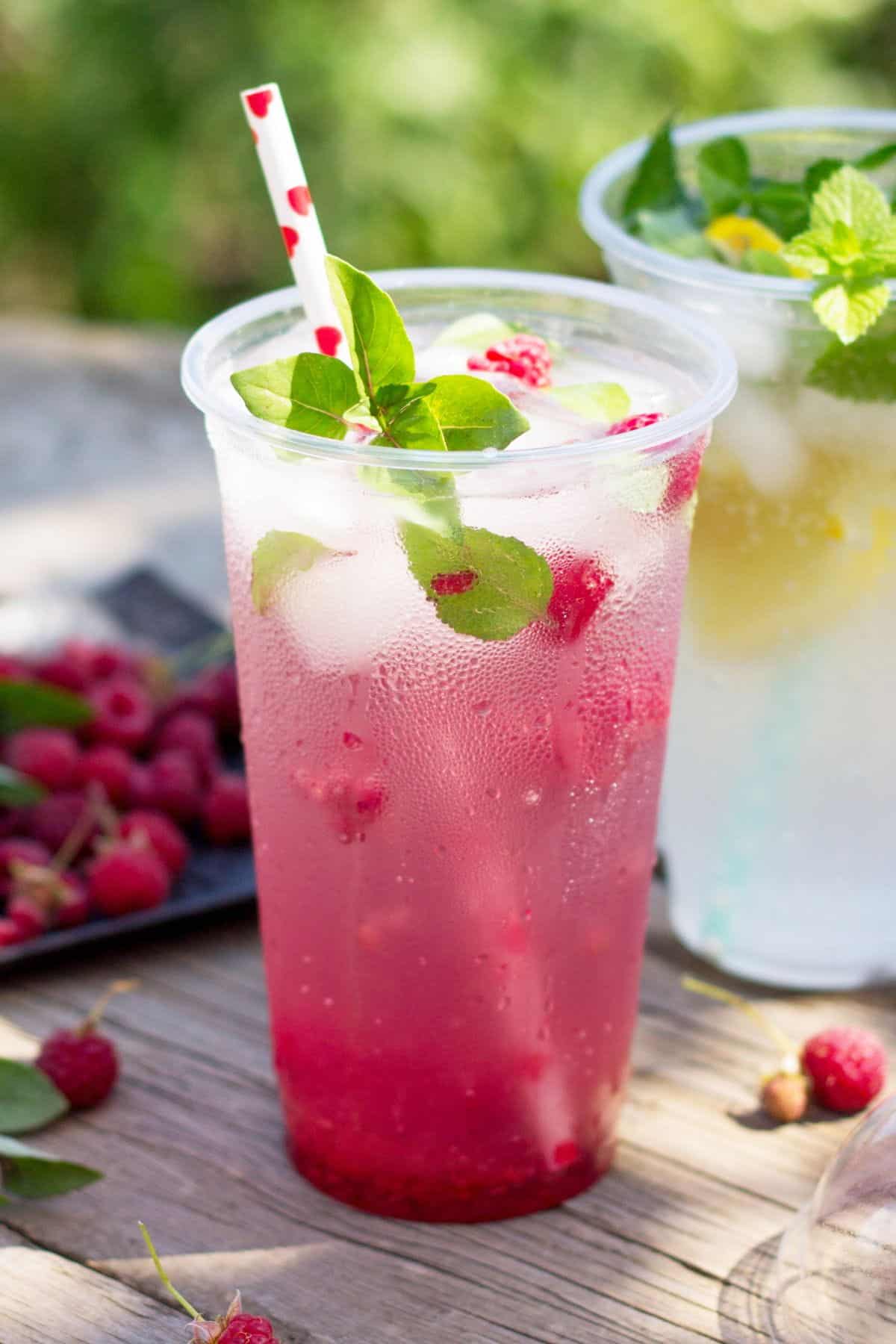 A cup of basil raspberry-infused water.