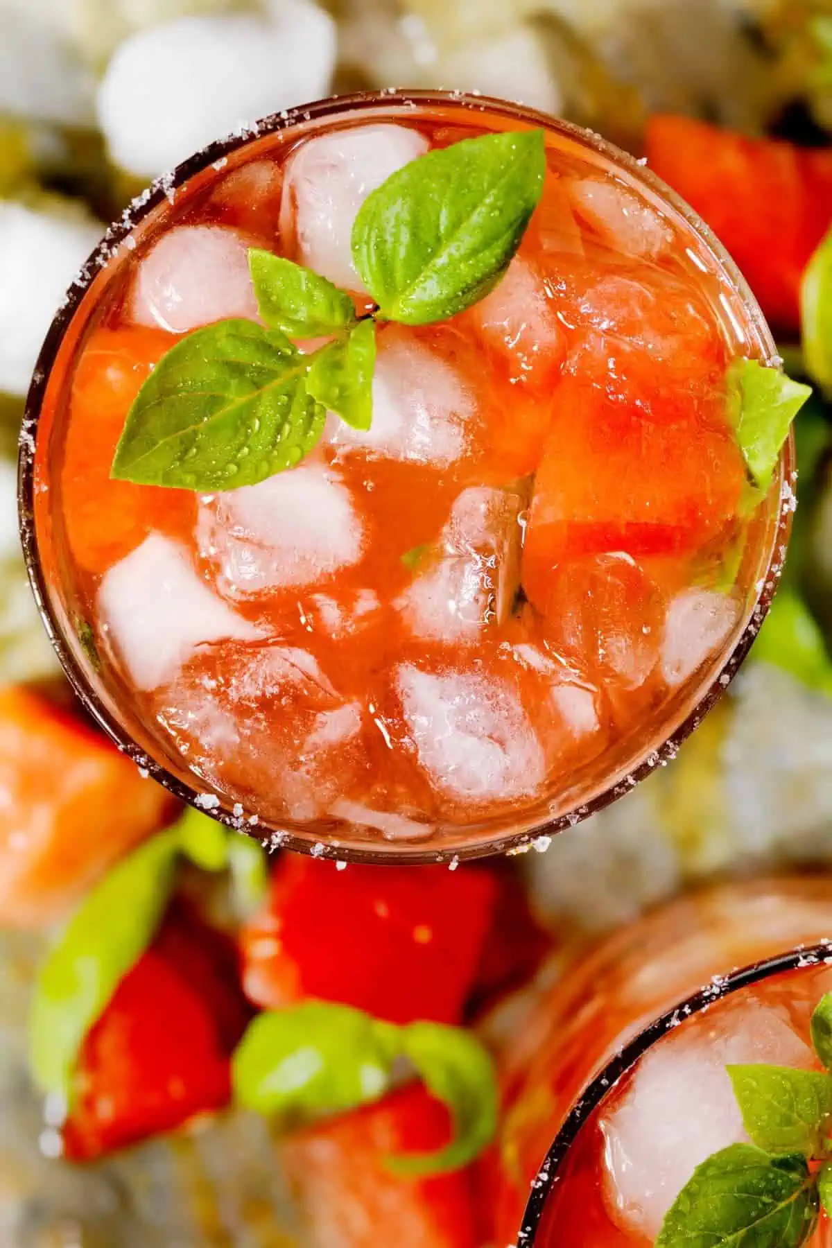 A top-down shot of basil watermelon-infused water.