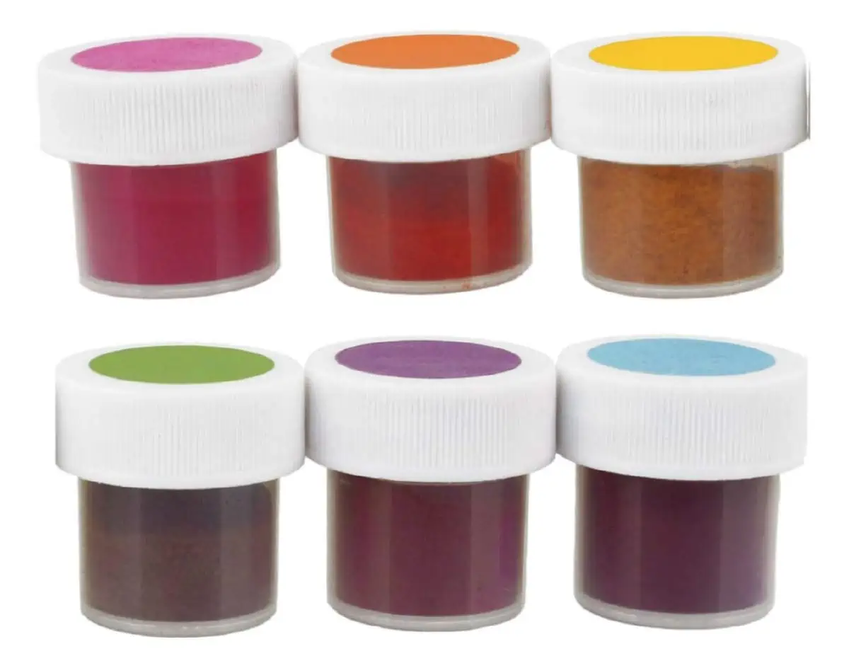 Six clear plastic containers filled with TruColor food coloring with a matching colorful circle on the white cover. 