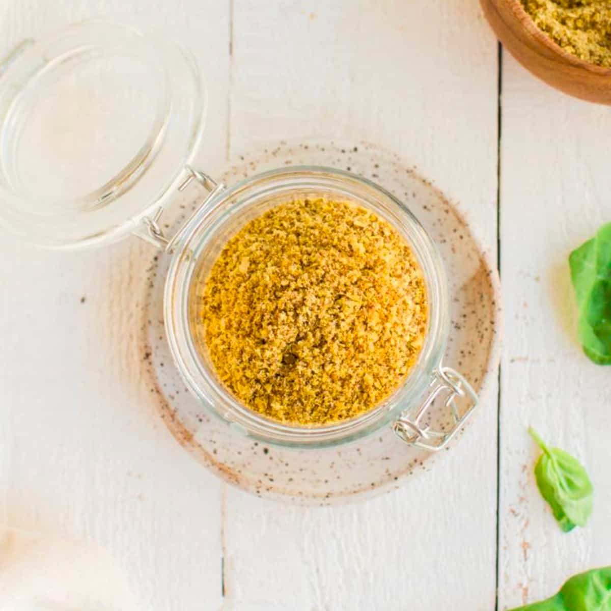 A glass jar filled with homemade chipotle seasoning.