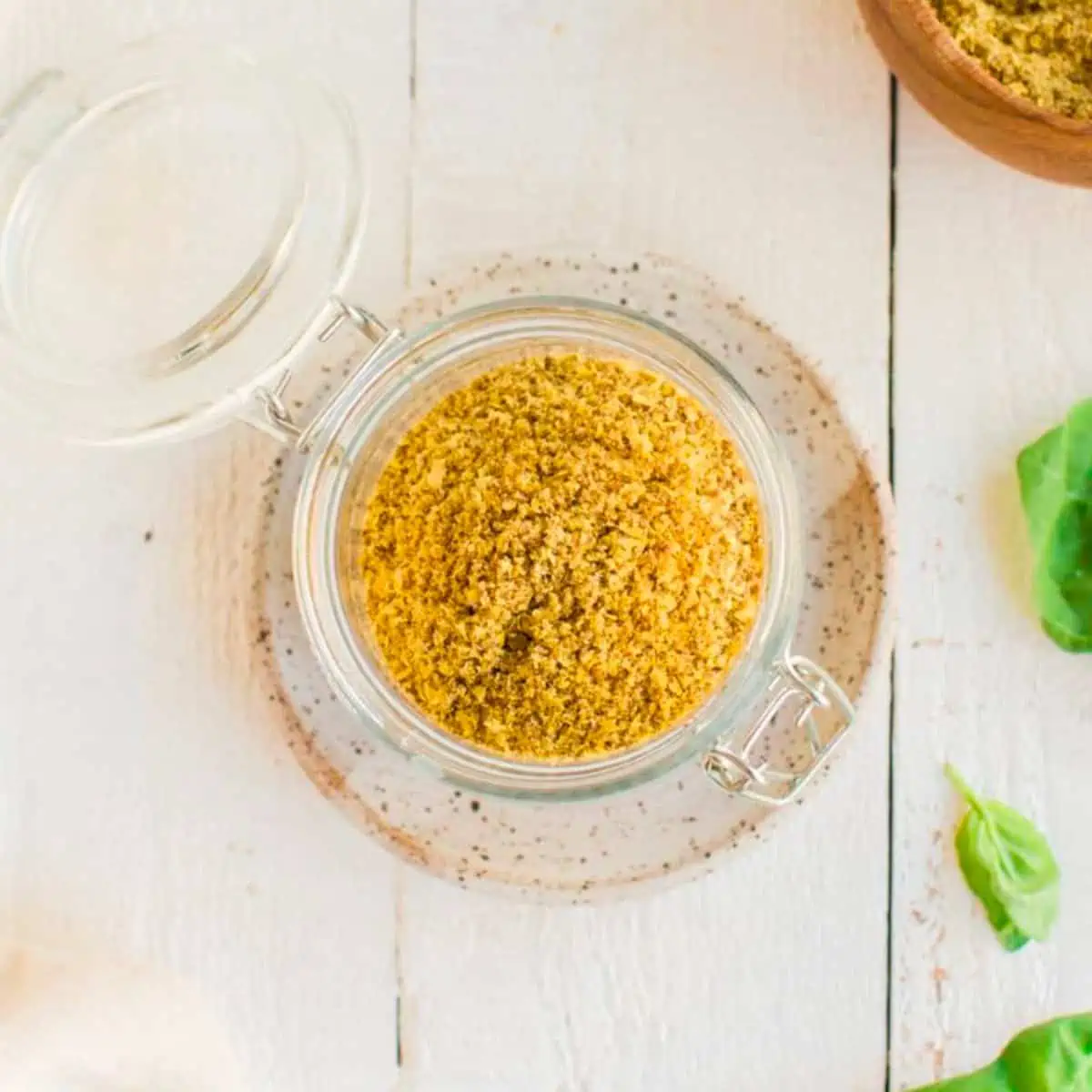 A glass jar filled with homemade chipotle seasoning.