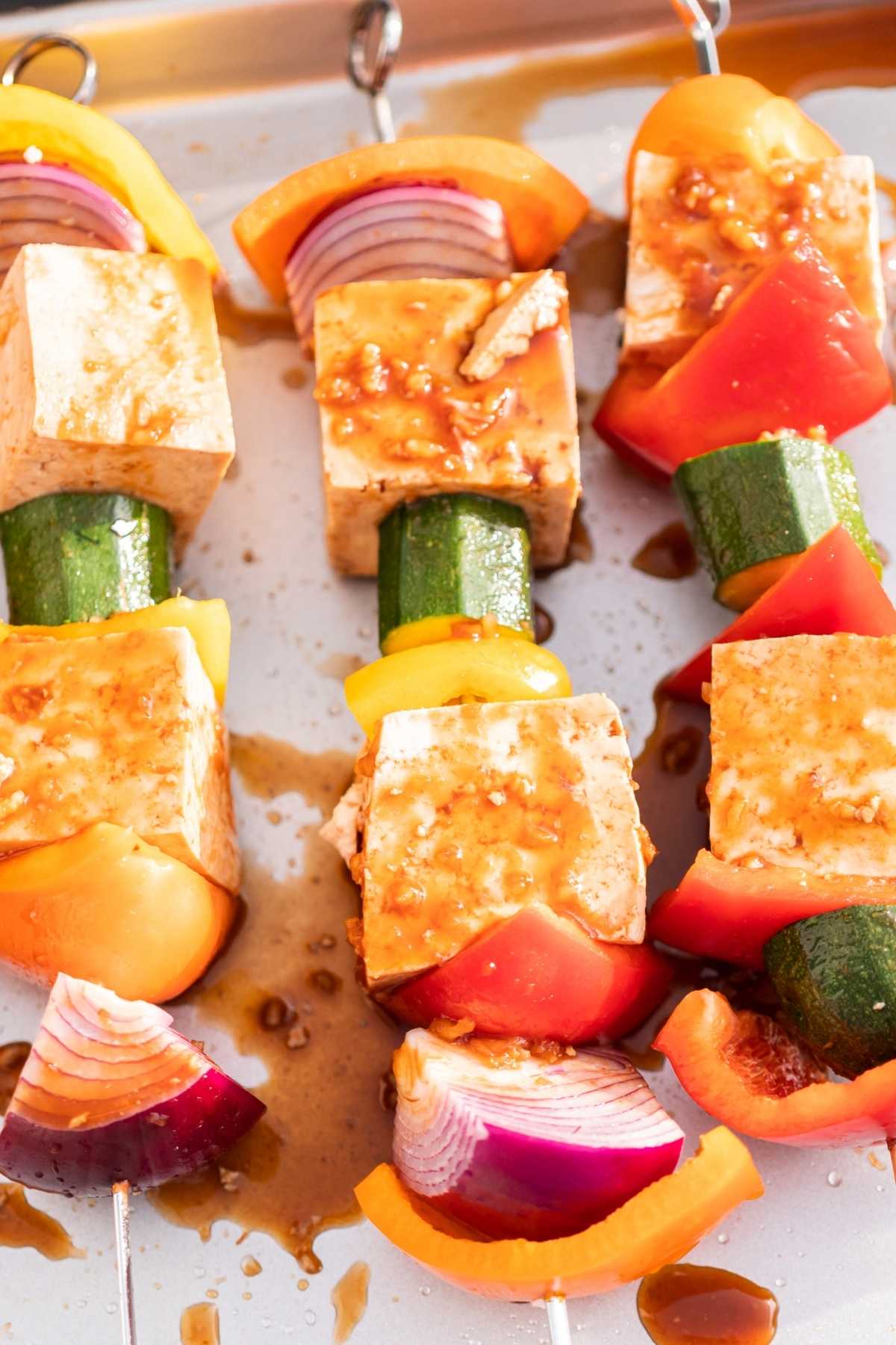 Tofu and colorful veggies with marinade.