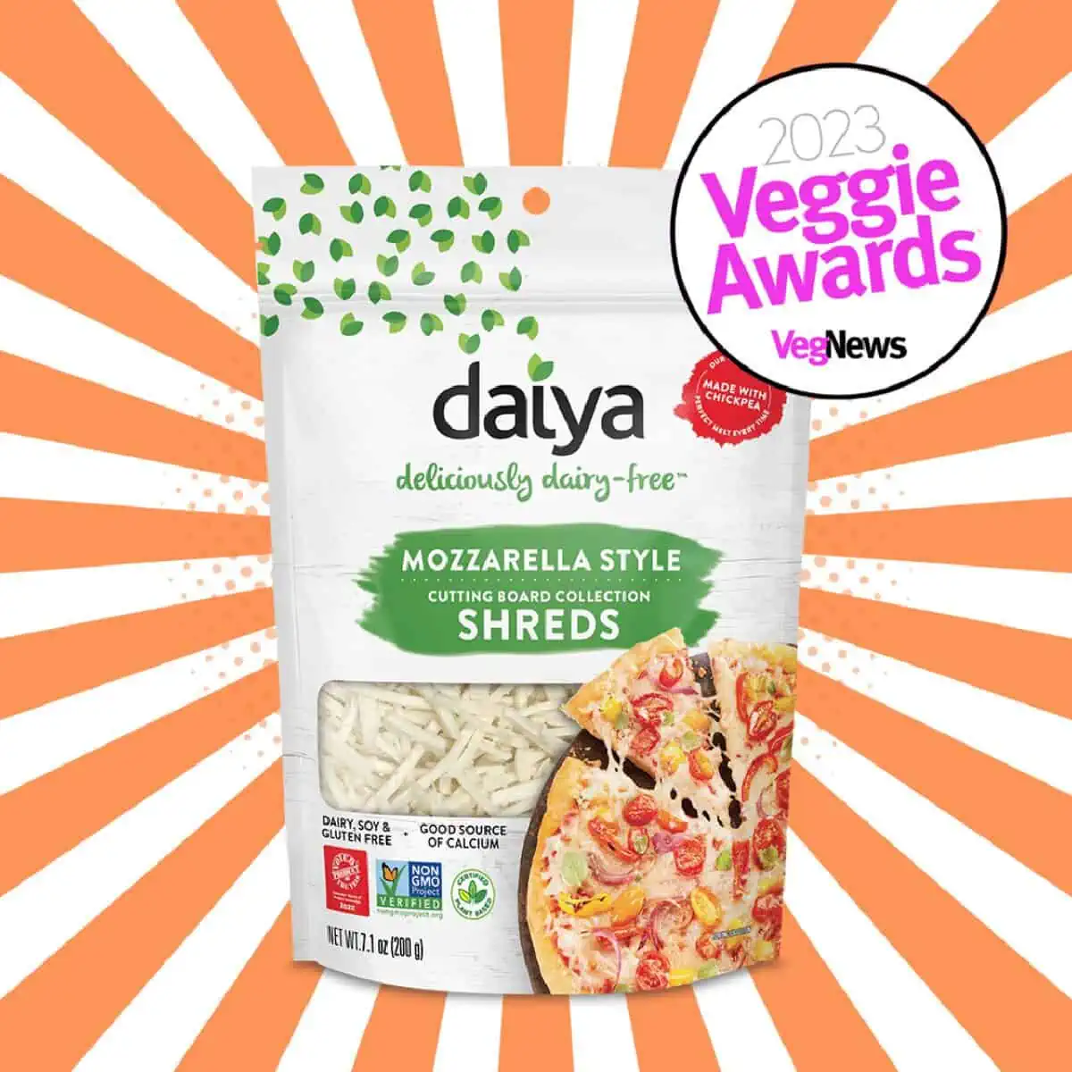 A white pouch of Daiya Vegan Mozzarella cheese shreds against an orange and white starburst background. 