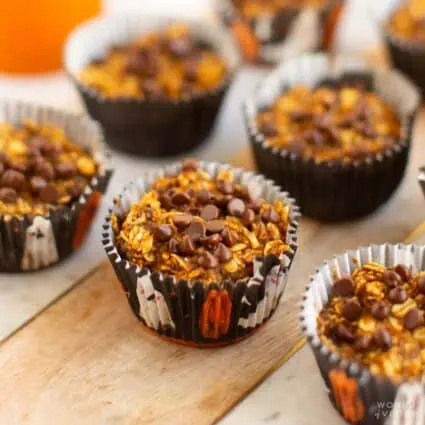 Pumpkin baked oatmeal bites in Halloween themed muffin wrappers.