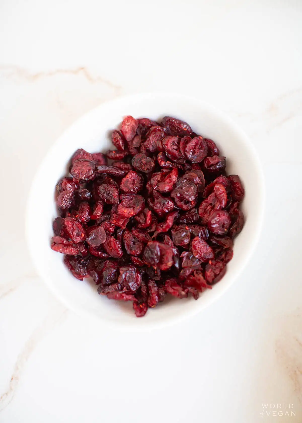 A small bowl of dried cranberries.