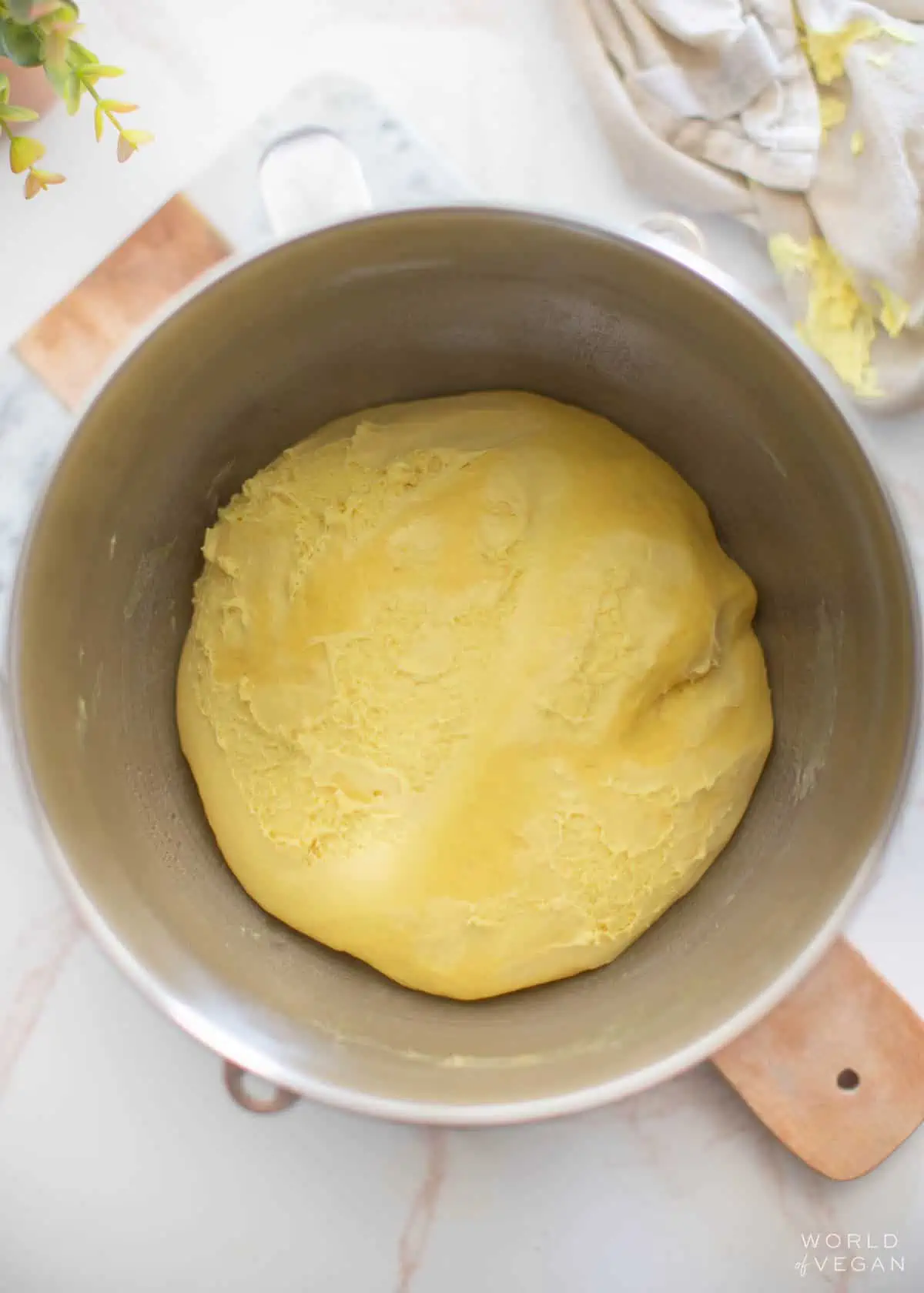 Vegan challah dough placed in a greased bowl to rise.
