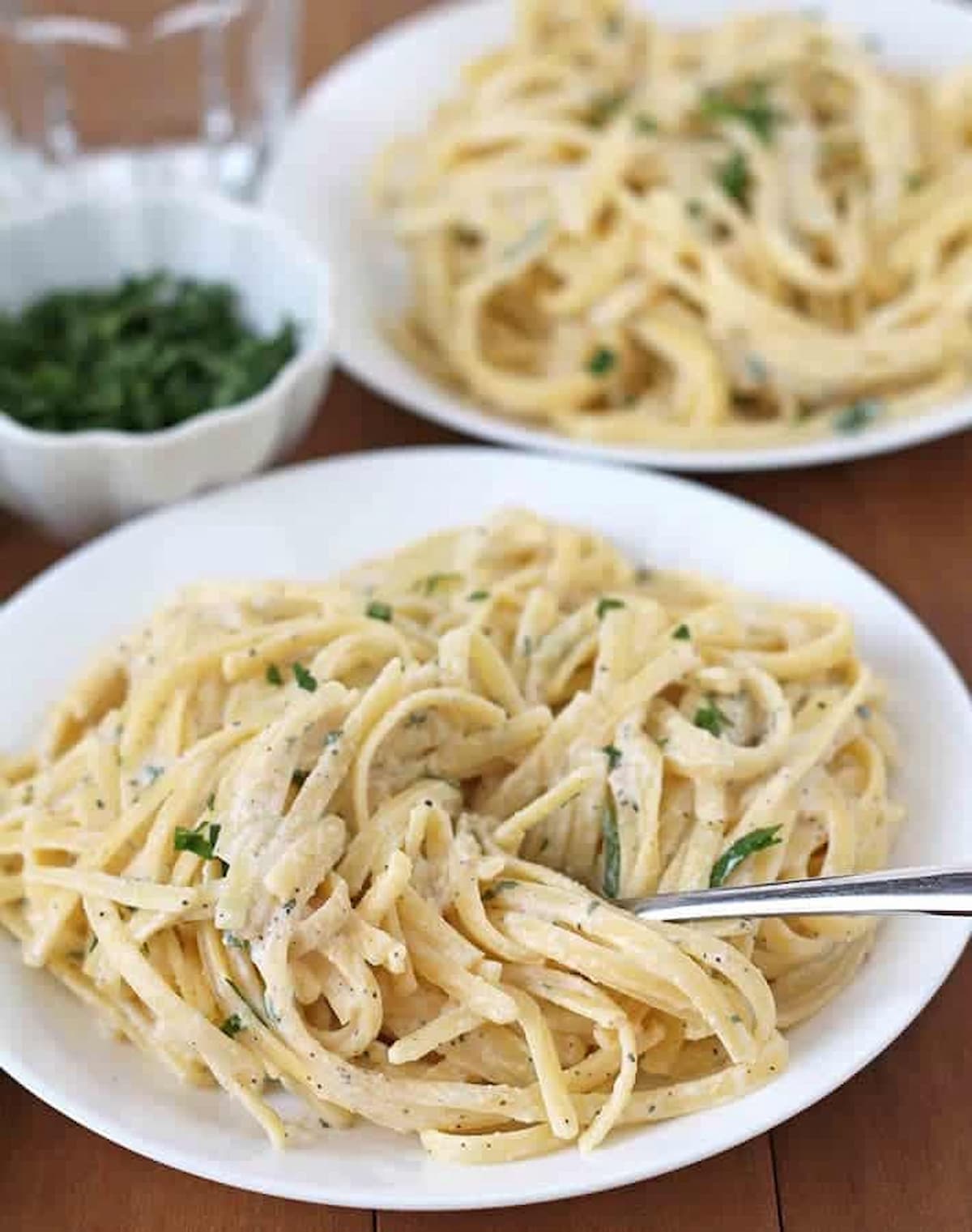A plate of vegan garlic pasta, made with silken tofu.