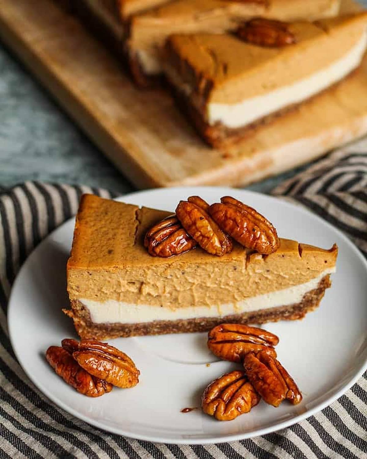 A slice of vegan pumpkin cheesecake made with silken tofu.