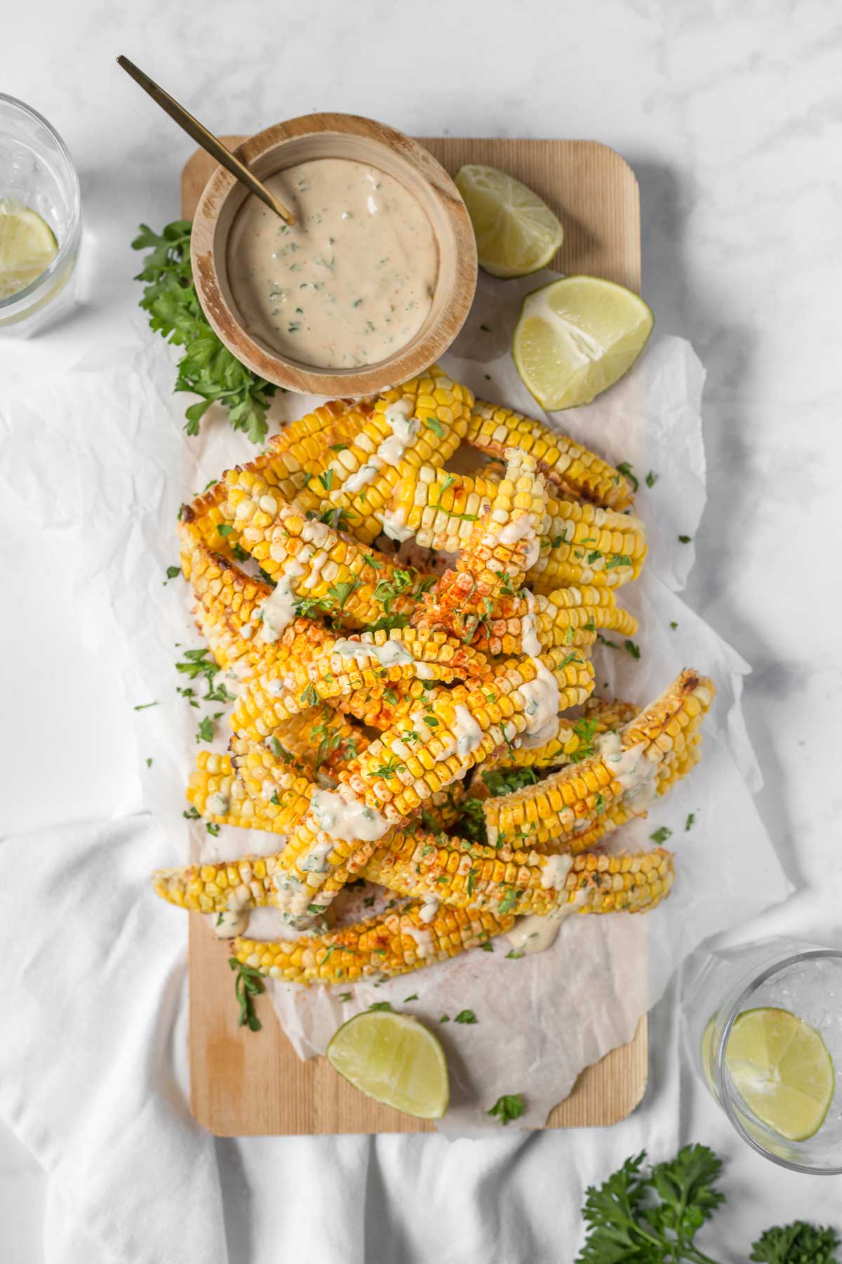 Corn ribs drizzled with vegan chipotle sauce.