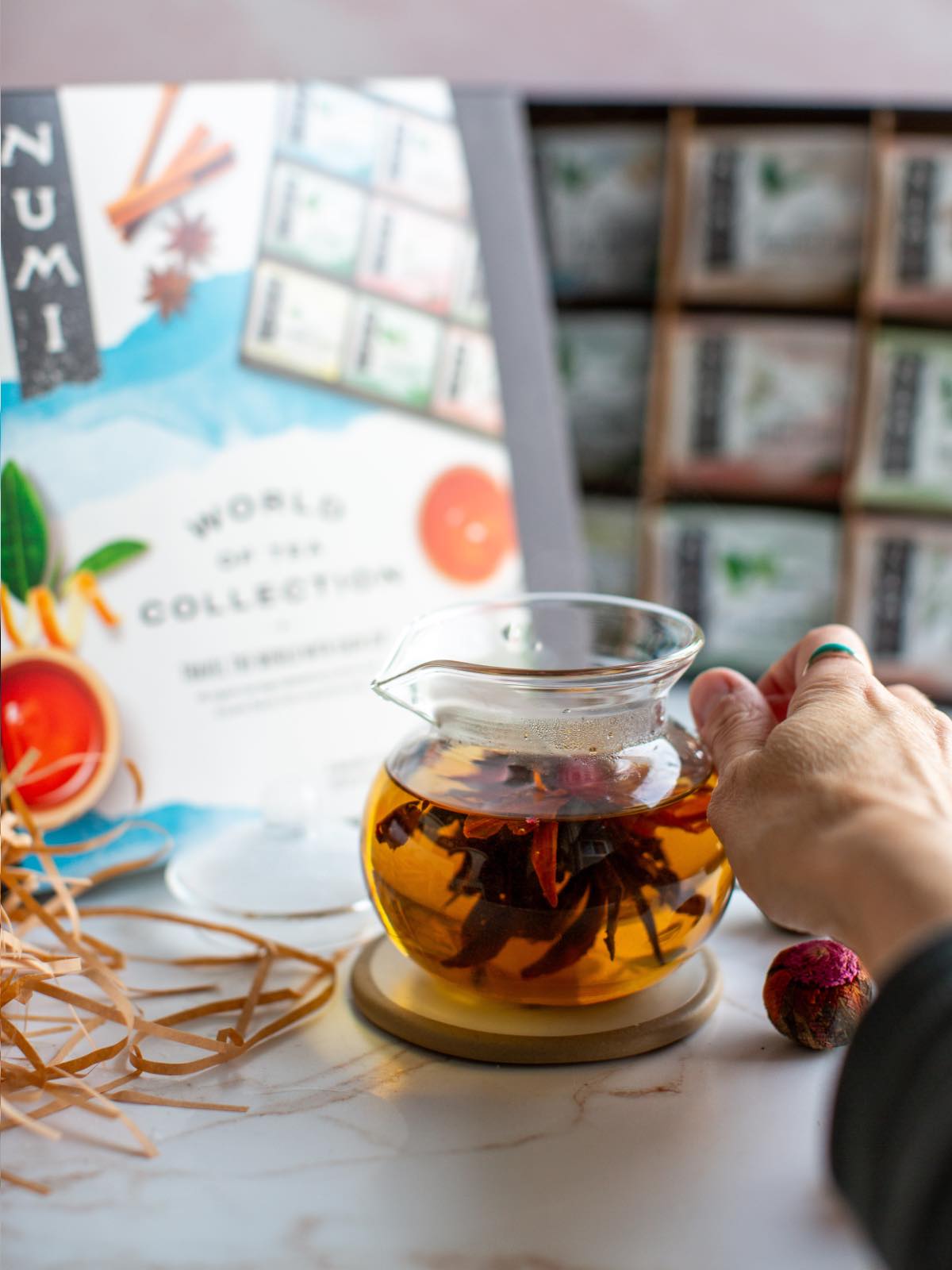 A gift basket set with Numi's flowering tea pods and special glass teapot. 