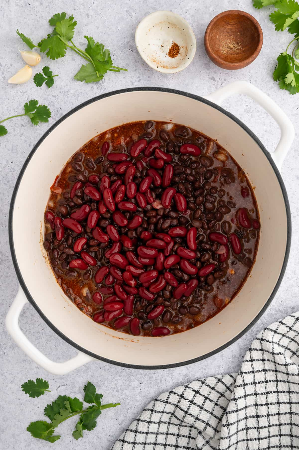 The remaining chili ingredients added to the large saucepan.