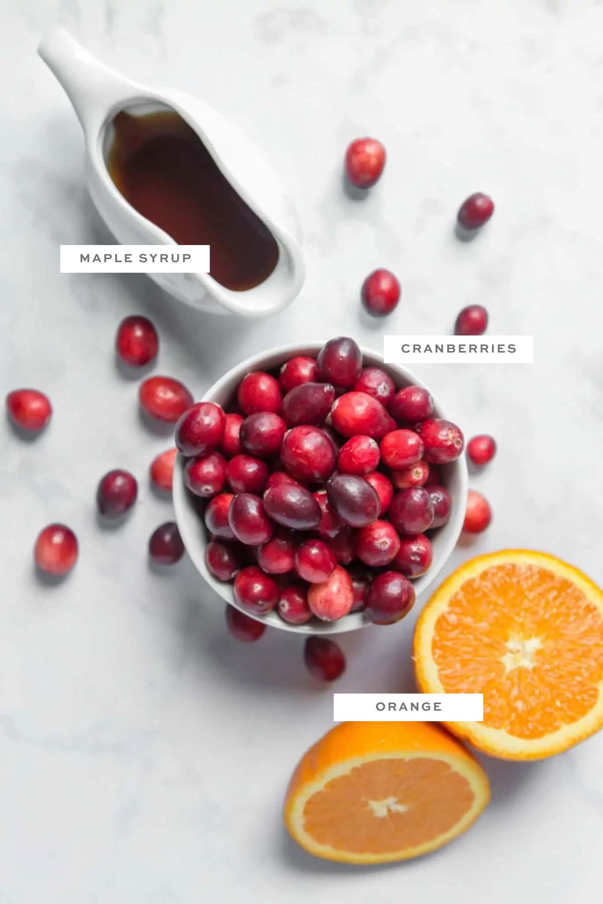 Key ingredients for vegan cranberry sauce with labels.