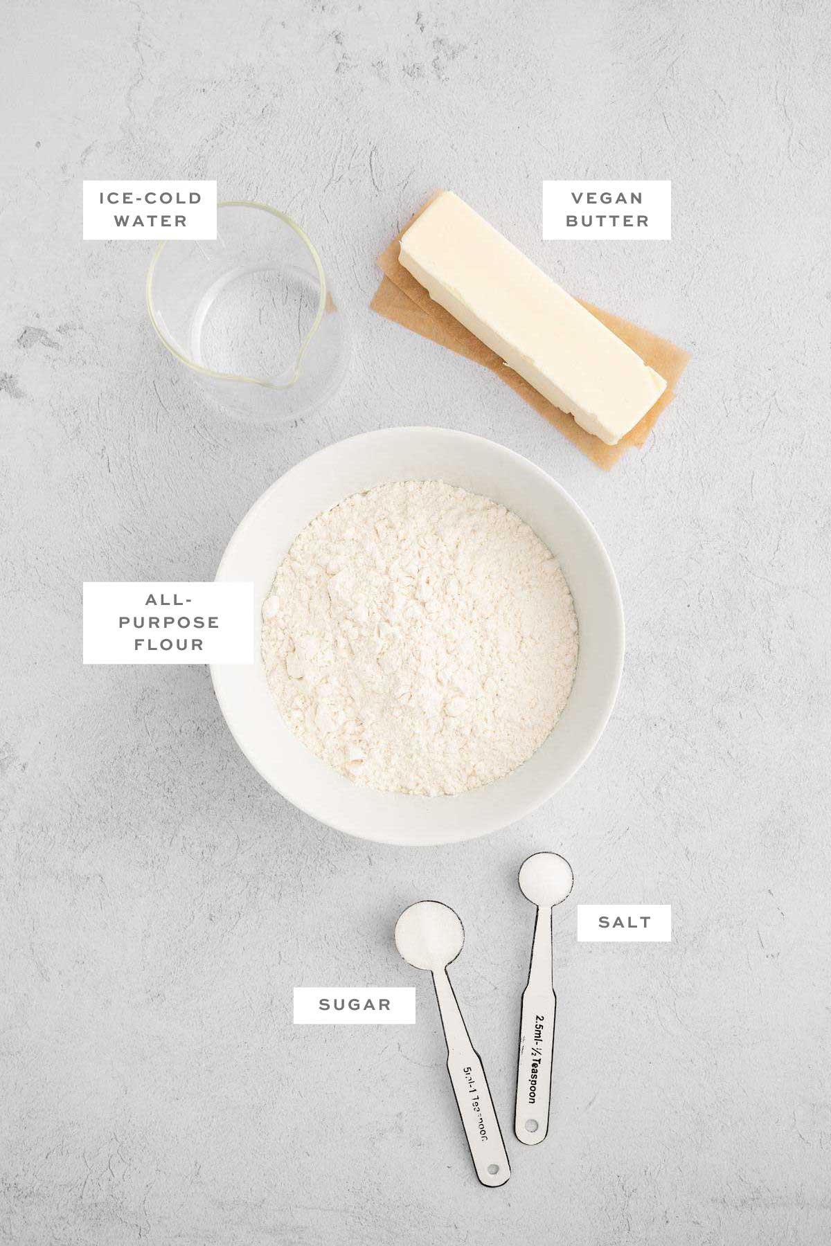 Key ingredients for a vegan pie crust with labels.