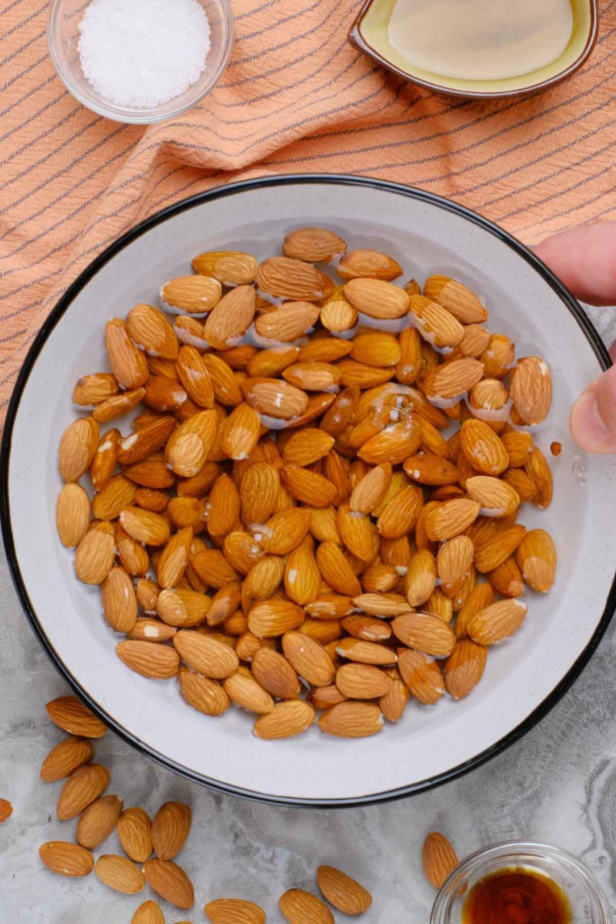 A bowl of almonds in water.