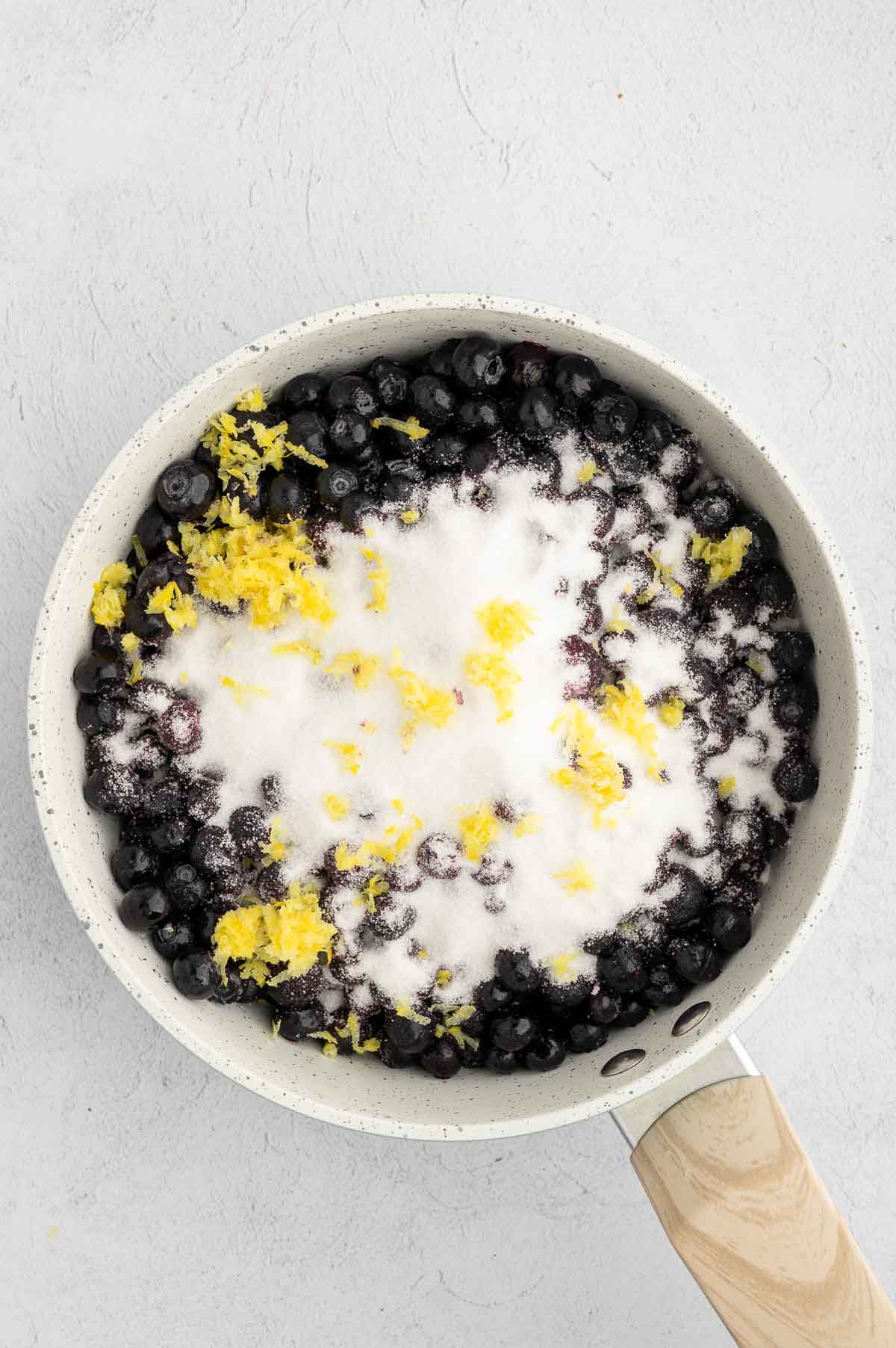 Blueberries, sugar, salt, vanilla extract, and lemon zest in a large saucepan.