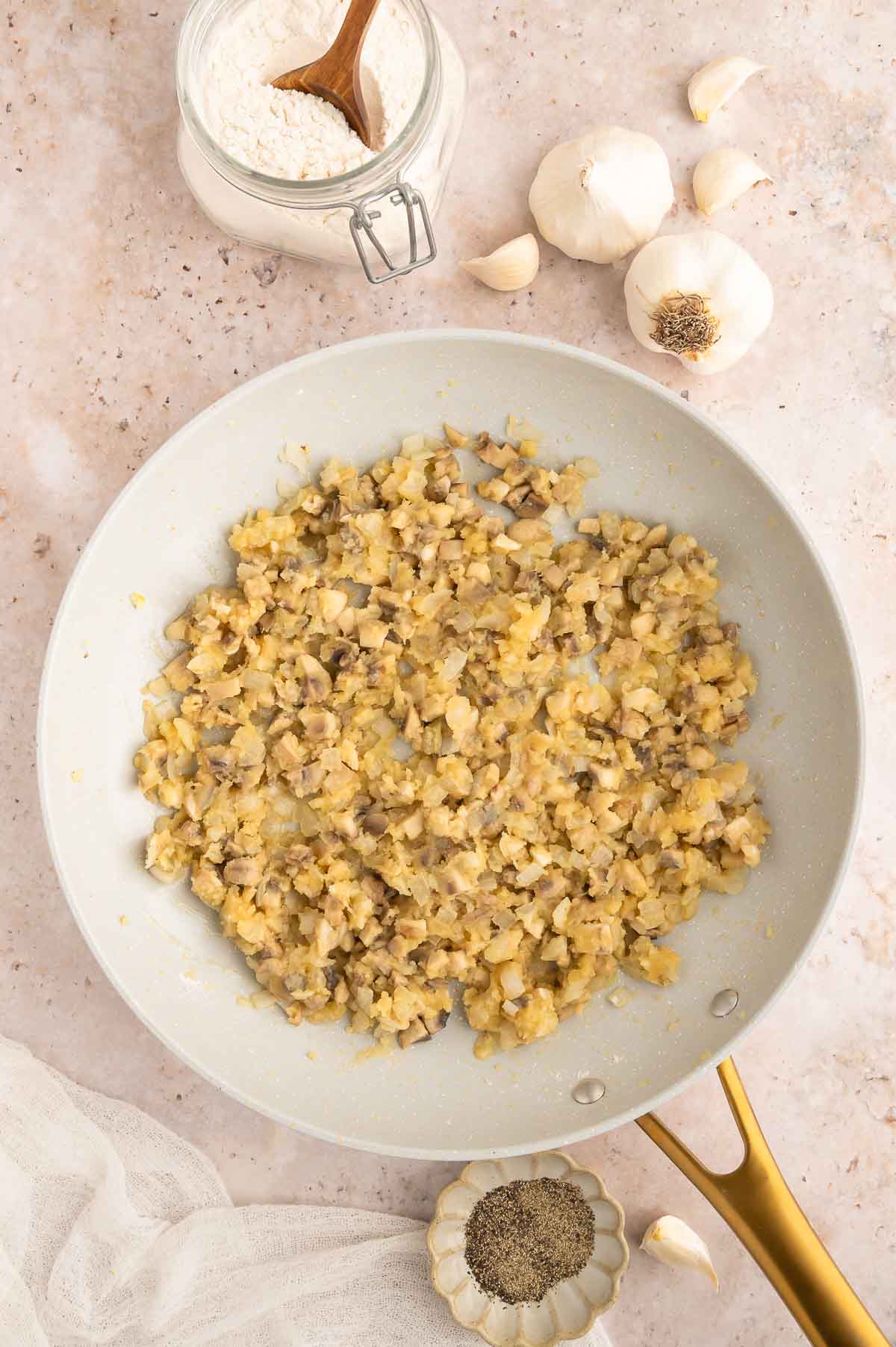 Flour stirred in to the mushroom mixture in the skillet to create a roux.