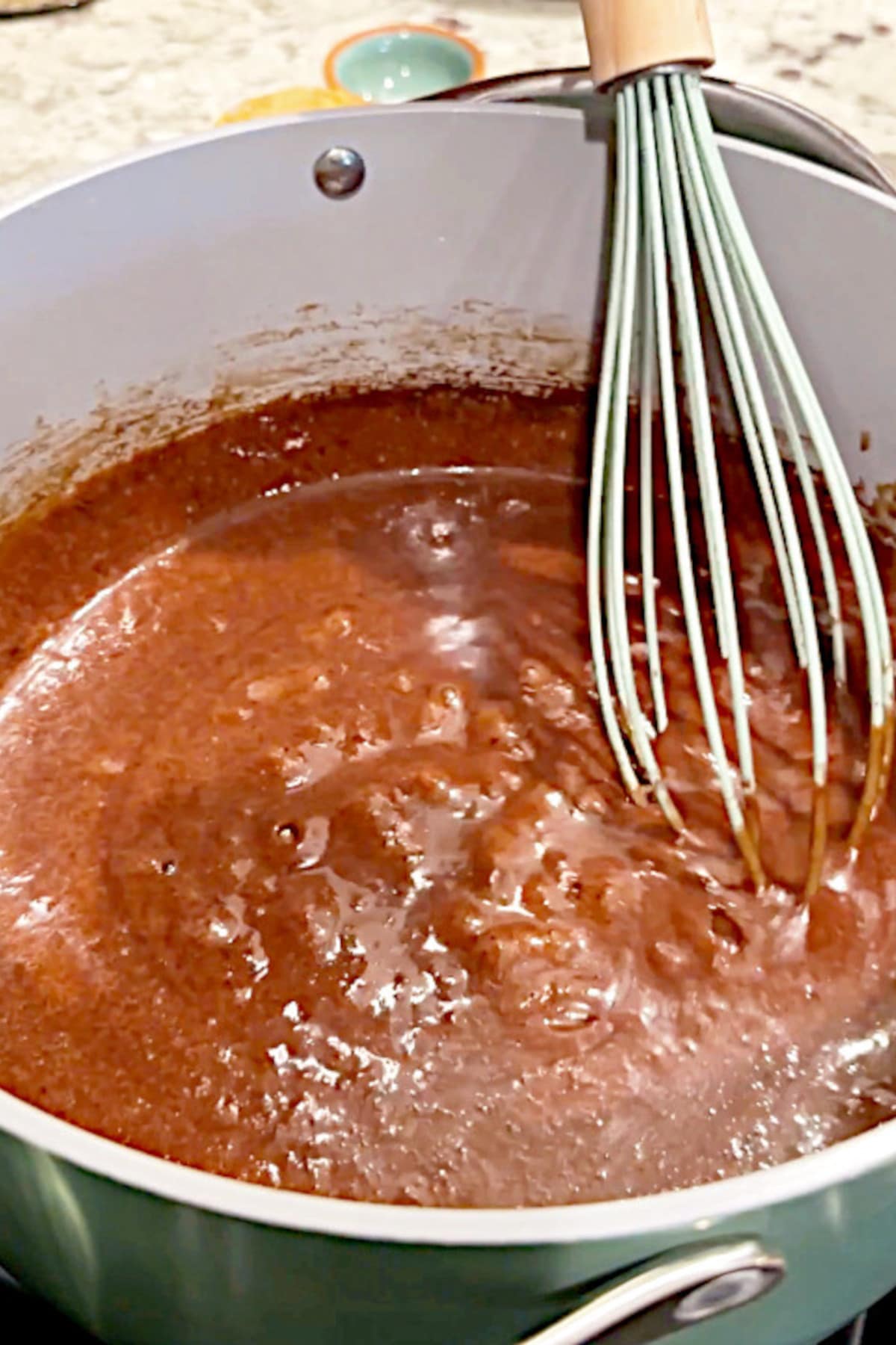 The cacao mixture boiling in a saucepan.