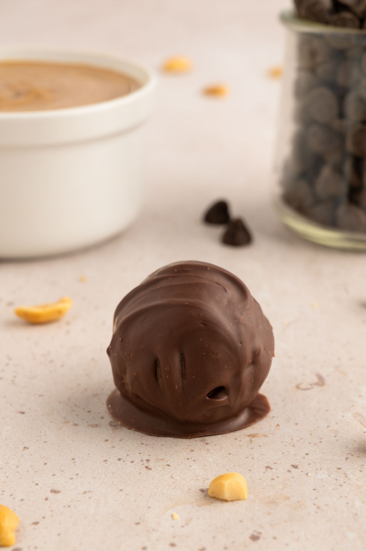 A cookie dough ball that has been dipped in chocolate.