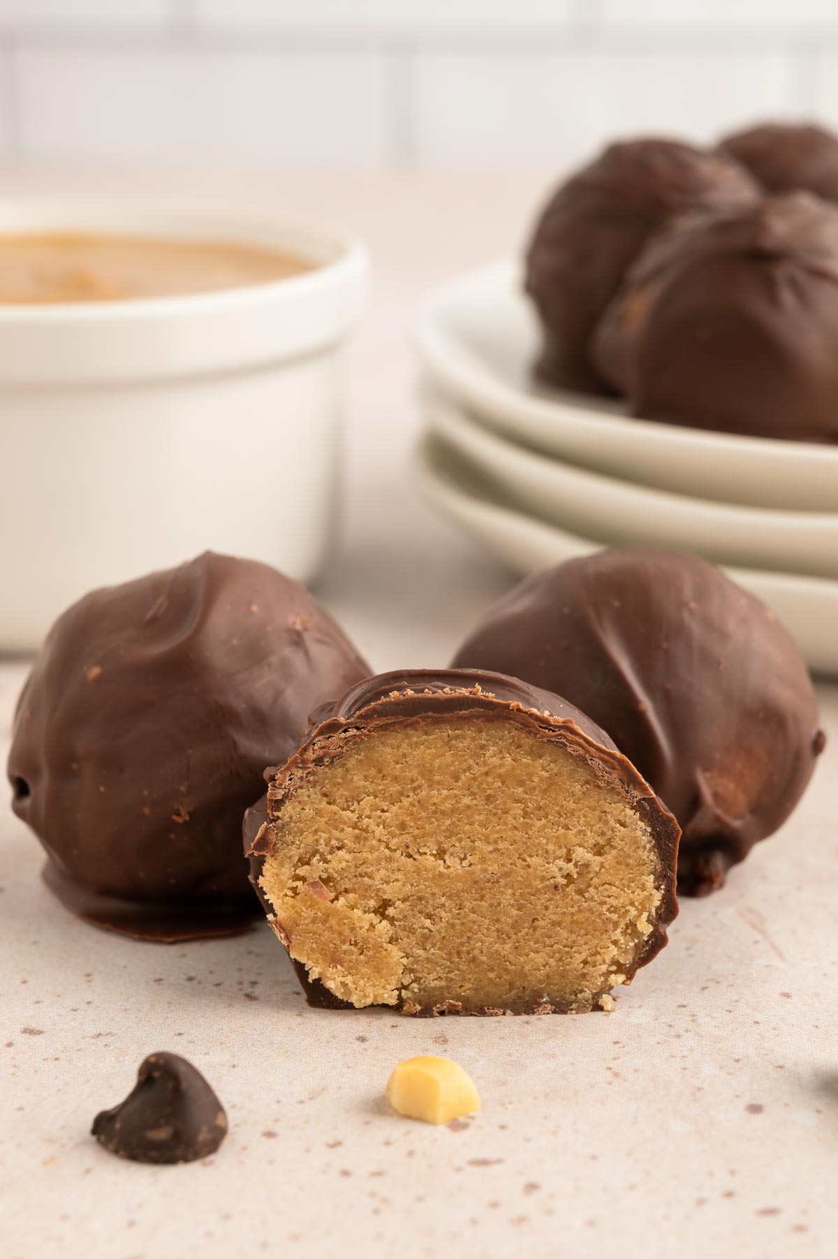 A chocolate-covered cookie dough ball, cut in half.