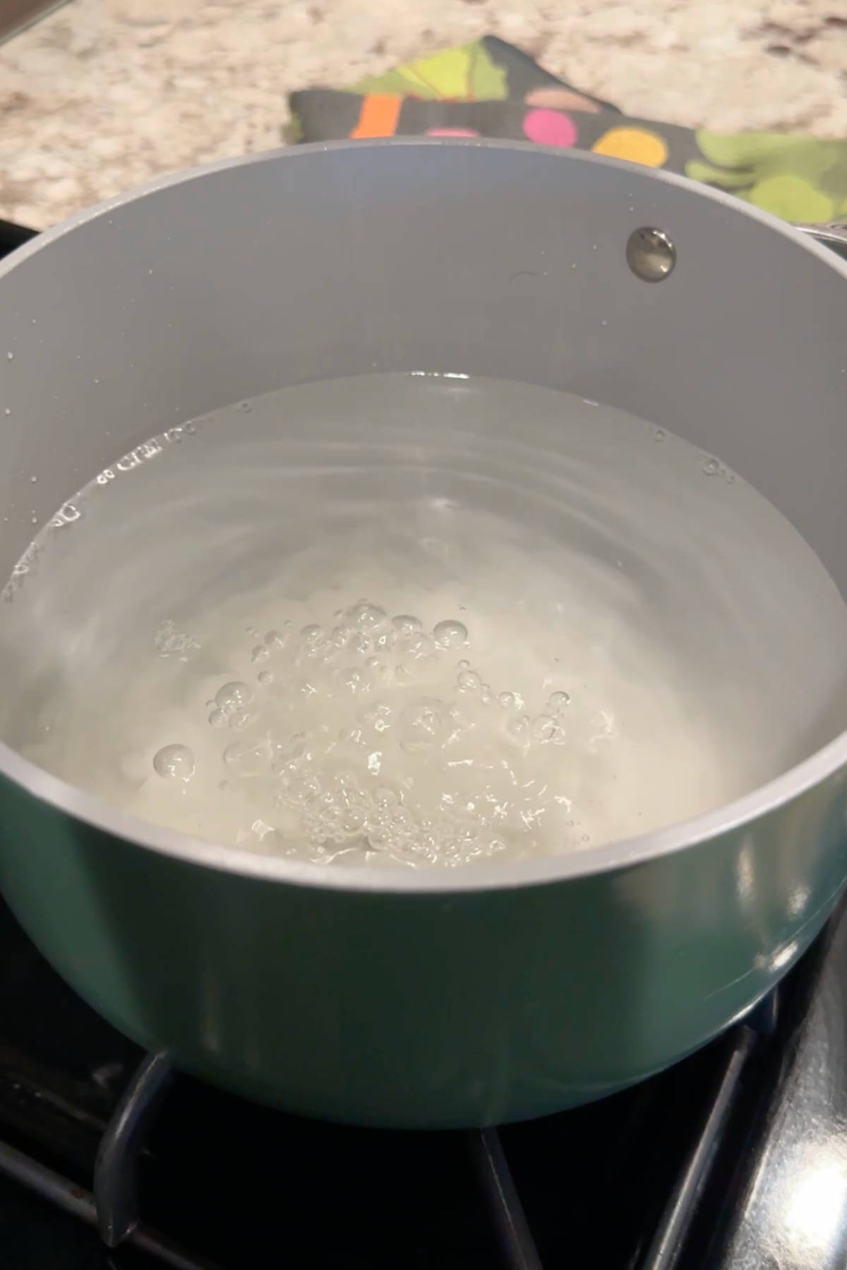 Pickling brine boiling in a large saucepan.