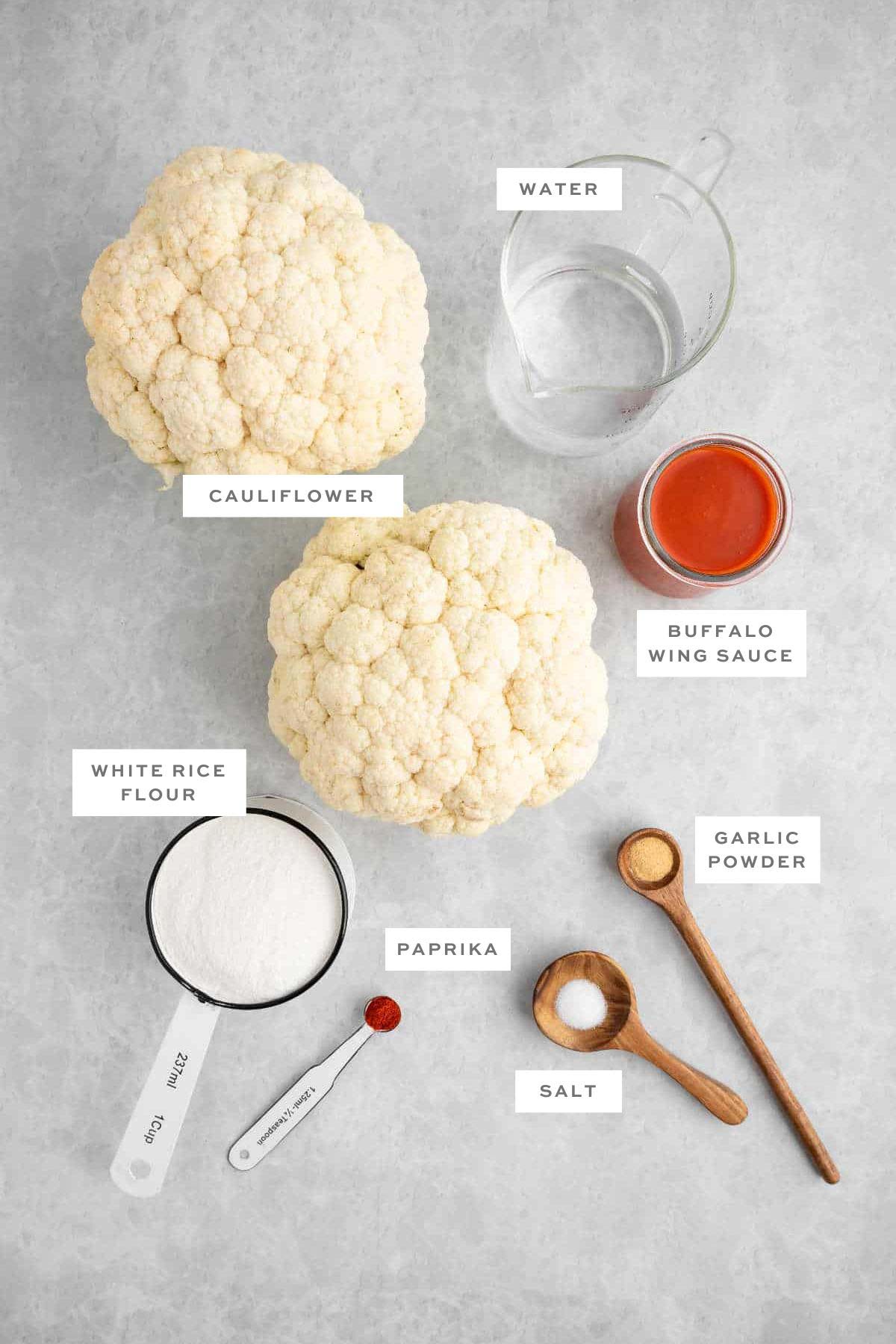 Key ingredients for vegan cauliflower wings with labels.