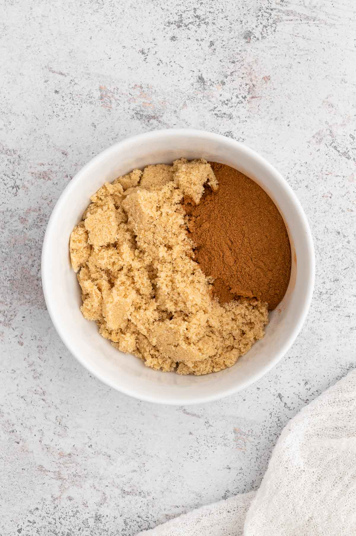 Cinnamon and sugar placed in a bowl.