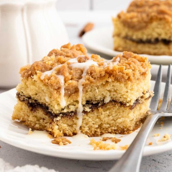 A slice of vegan coffee cake with icing.