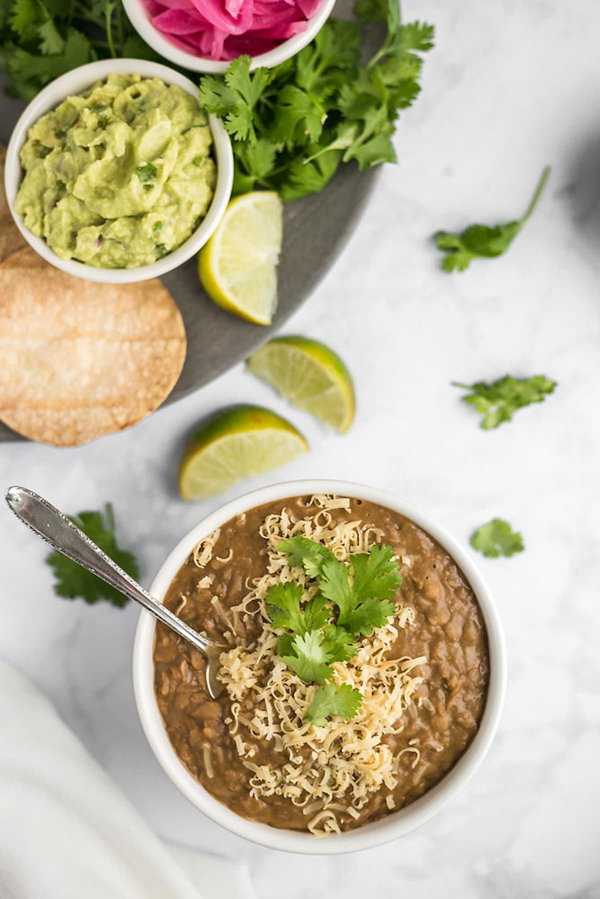 Refried beans served with a platter of veggies.