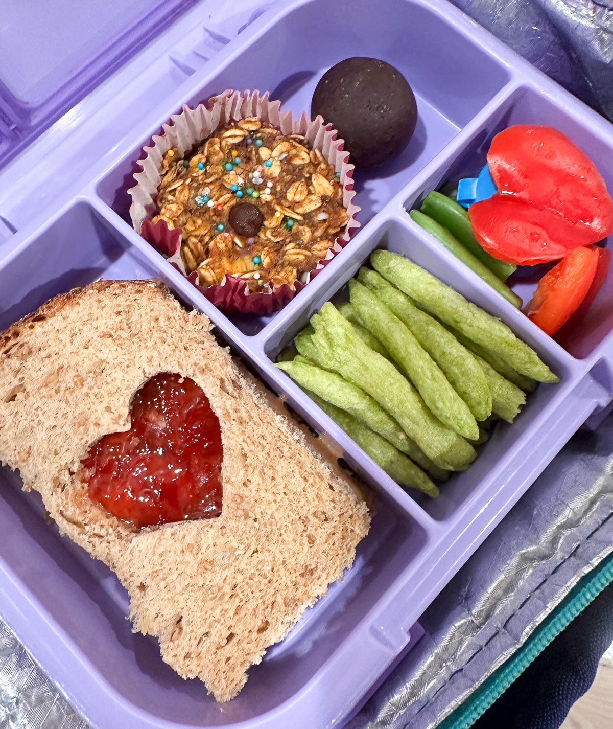 Bentgo lunchbox with heart-shaped vegan snacks for Valentine’s Day.