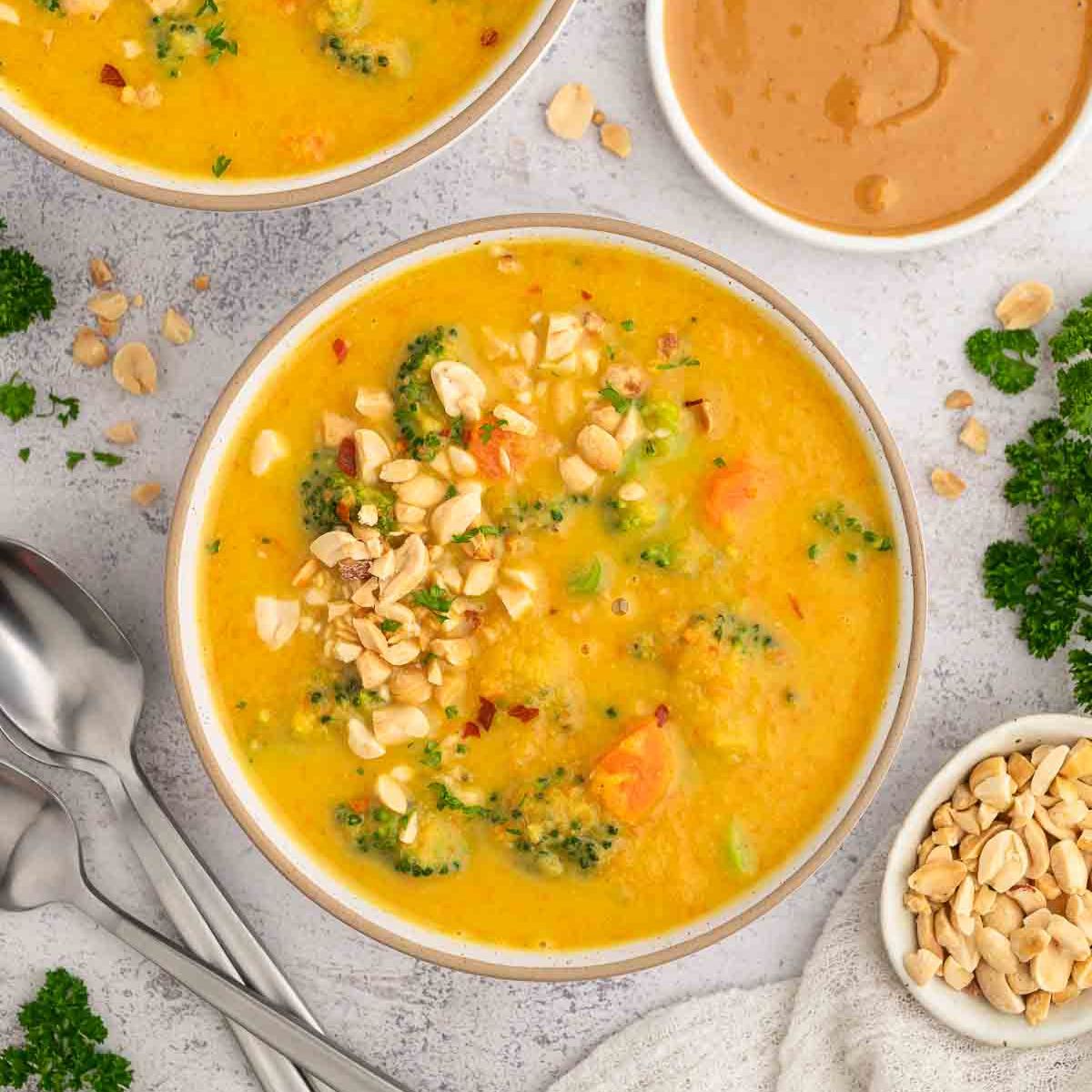 Broccoli and peanut butter soup served in a bowl.