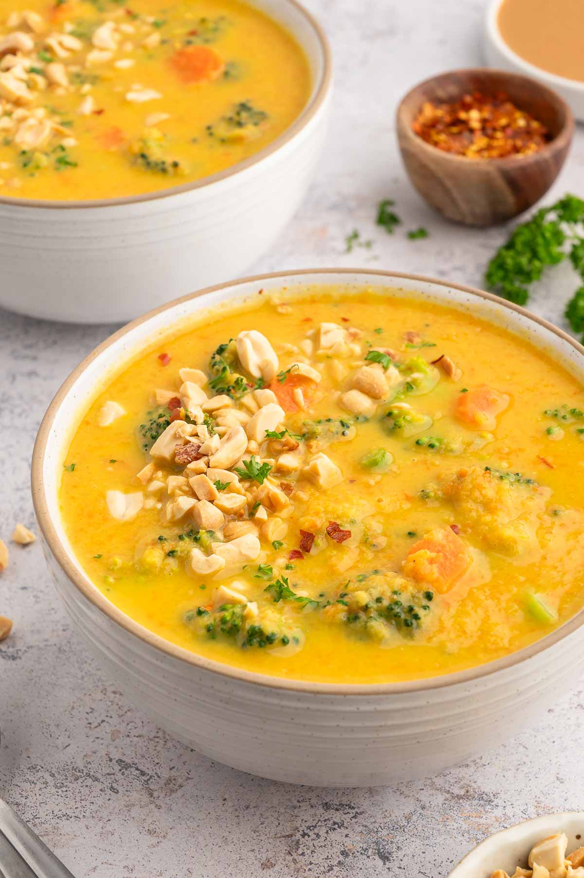 A bowl of broccoli and peanut butter soup.