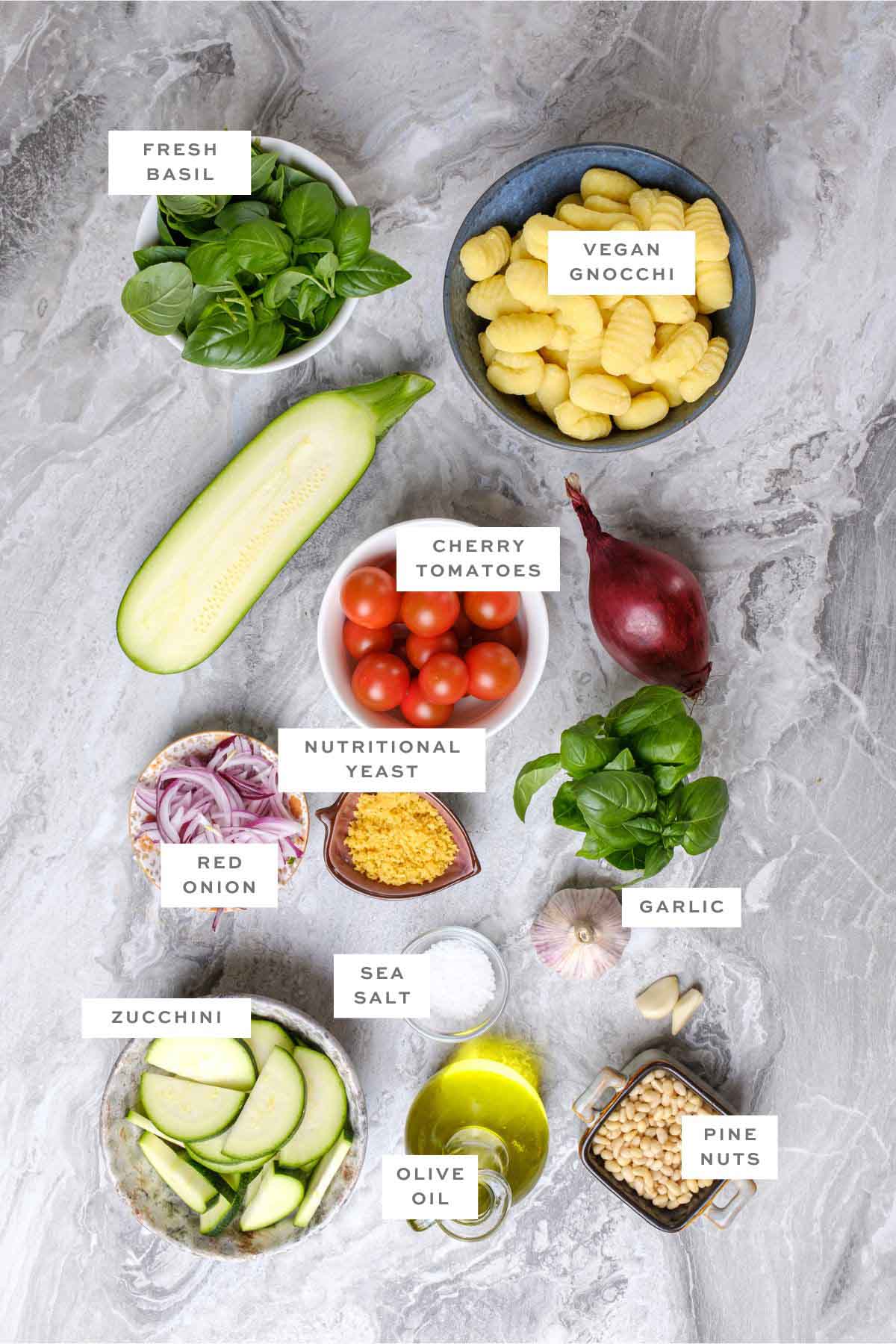 Ingredients for vegan pesto gnocchi, with labels.