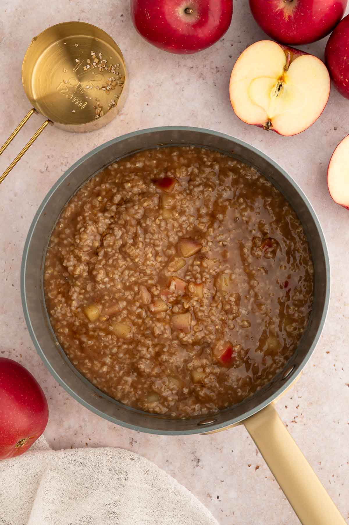 A saucepan with apple cinnamon oats simmering.