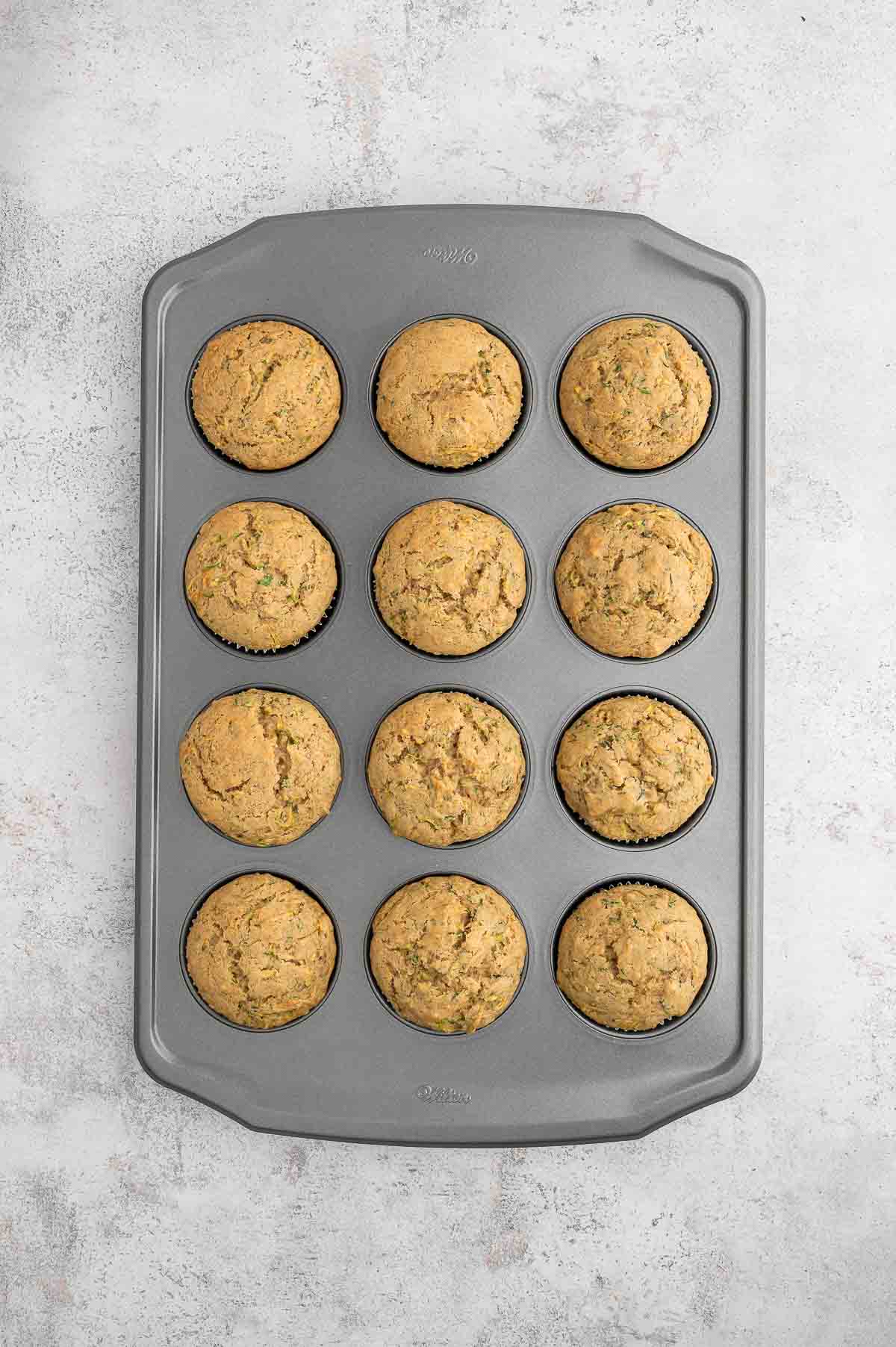 Vegan zucchini muffins in a tin.