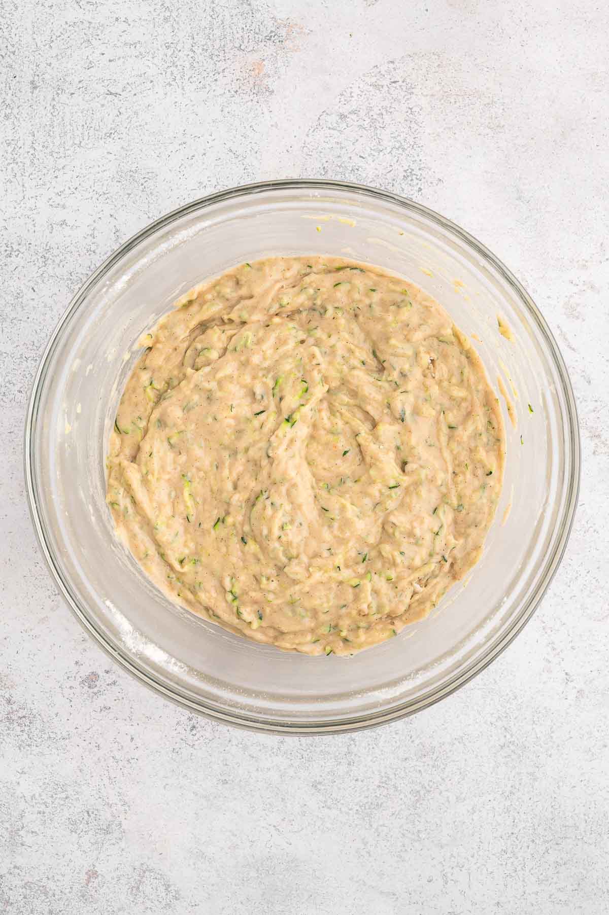 Vegan zucchini batter in a bowl.