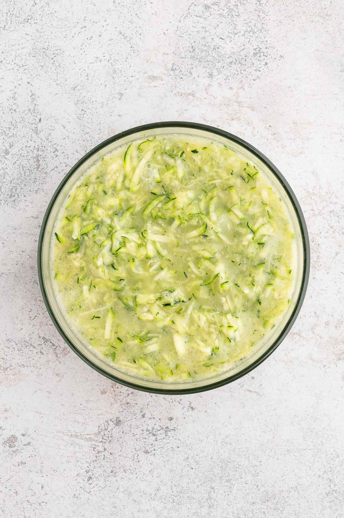 Zucchini wet ingredients in a bowl.