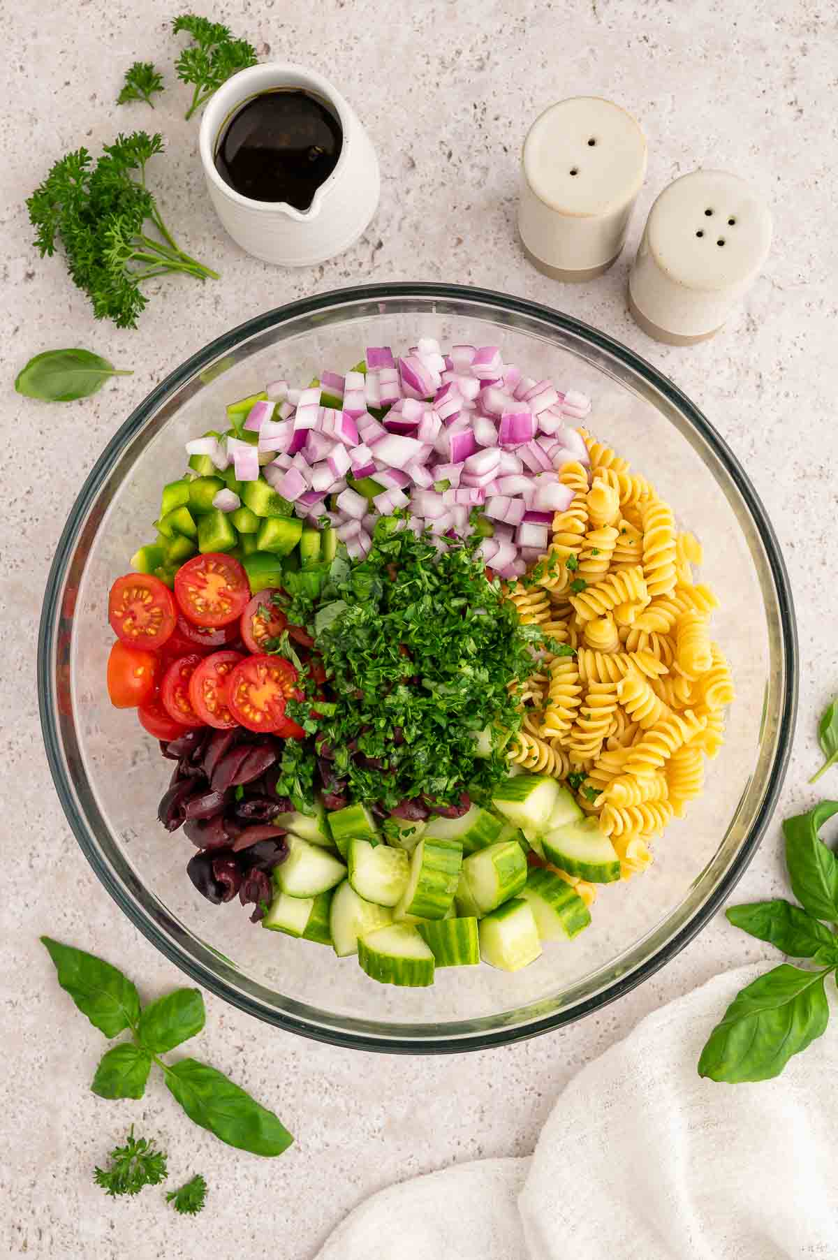 Ingredients for this vegan pasta salad recipe added to a large bowl.