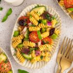 Vegan pasta salad on a serving plate.