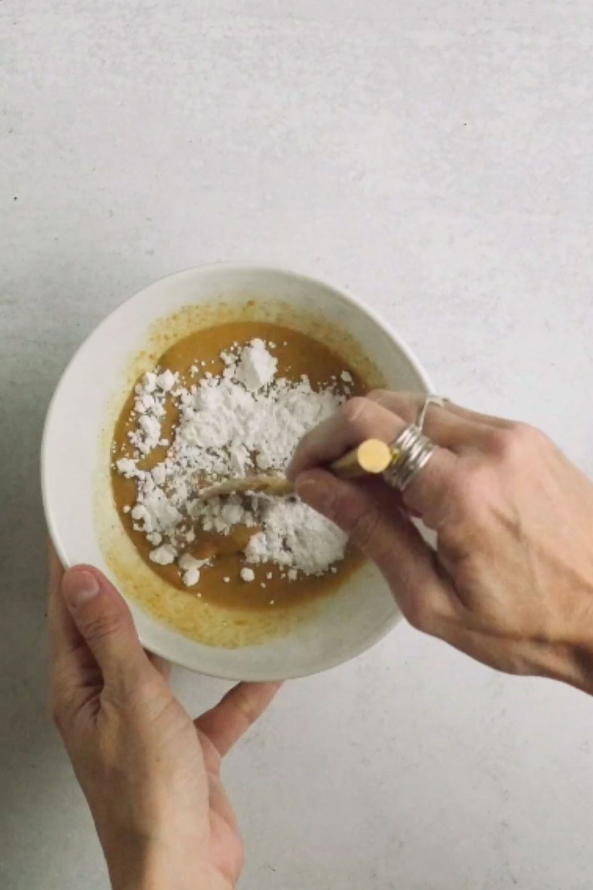 Peanut butter mixed with powdered sugar in a bowl.