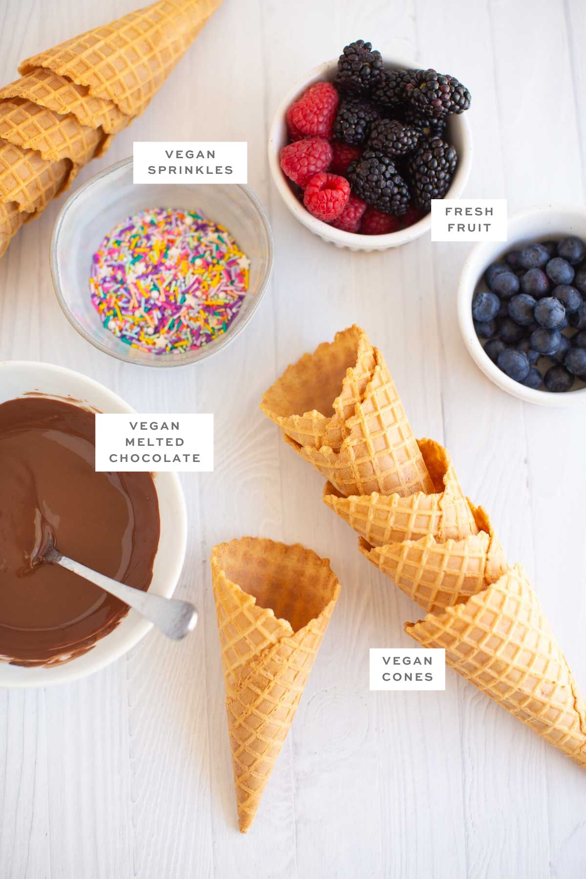 Key ingredients for fruit cones with labels.